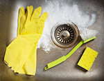 Clean the splash guard and stopper monthly.
